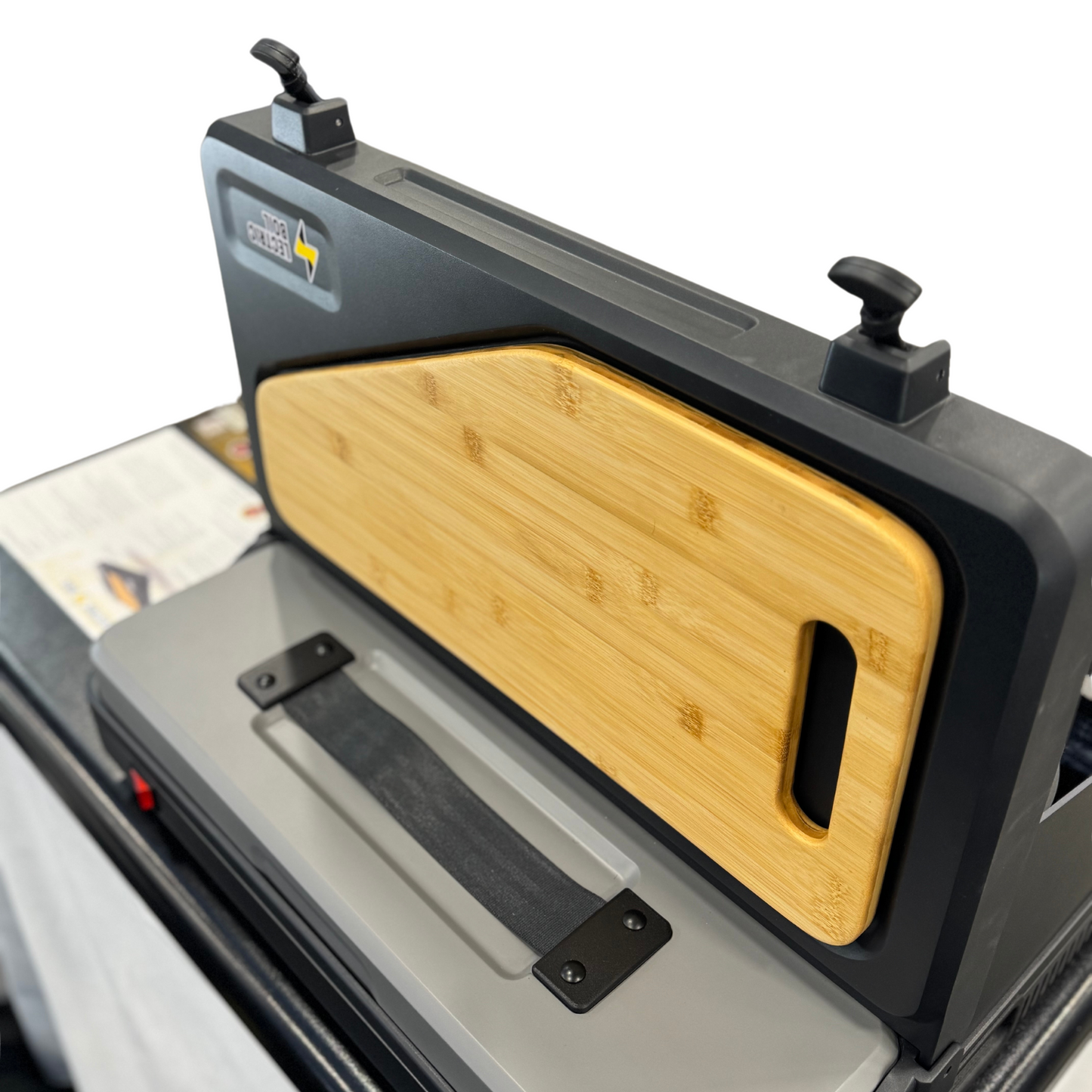 The first portable induction stove and generator with a removable battery and dual burners for campers, outdoor workers, victims of natural disasters — and anyone, anywhere, cooking or surviving off-grid. Pictured here with the lid open and the removable cutting board shown.