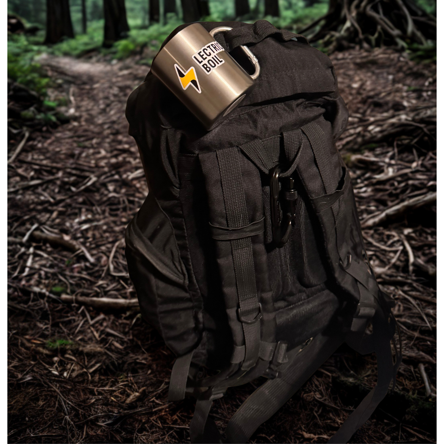 Black backpack on a trail with a metal Lectric Boil mug hanging. The first portable induction stove and generator with a battery and dual burners for campers, outdoor workers, natural disasters — and anyone, anywhere, cooking or surviving off-grid.
#productimage
#lifestyle