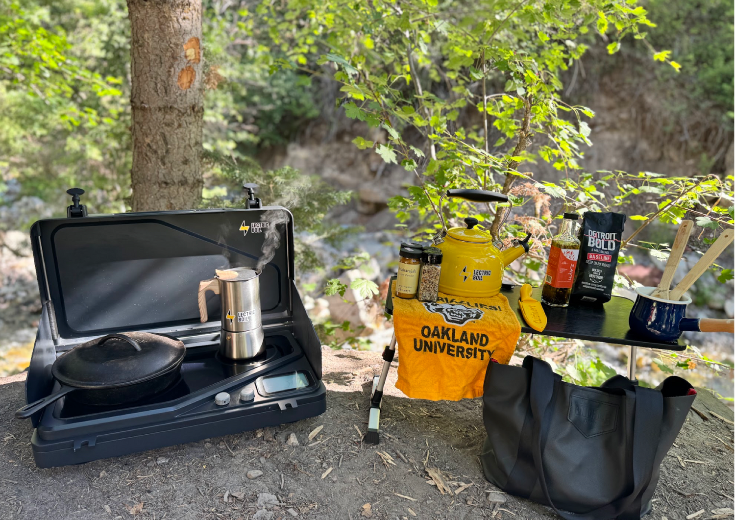 Lectric Boil camping stove with water boiling and a cast iron stove with a table full of cooking and coffee. The first portable induction stove and generator with a battery and dual burners for campers, outdoor workers, natural disasters — and anyone, anywhere, cooking or surviving off-grid.
#productimage
#overlander
#lifestyle
